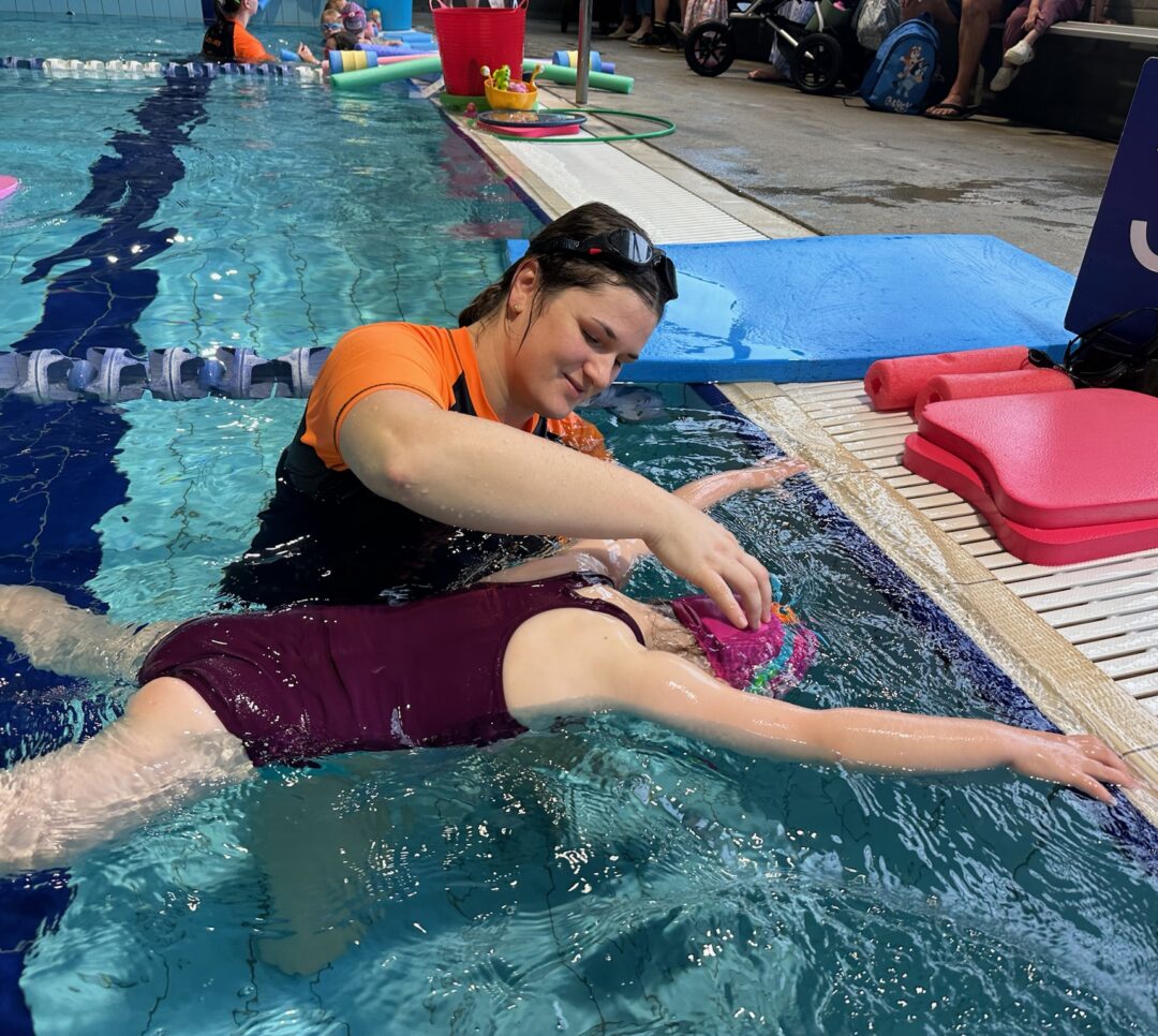 child learning to swim