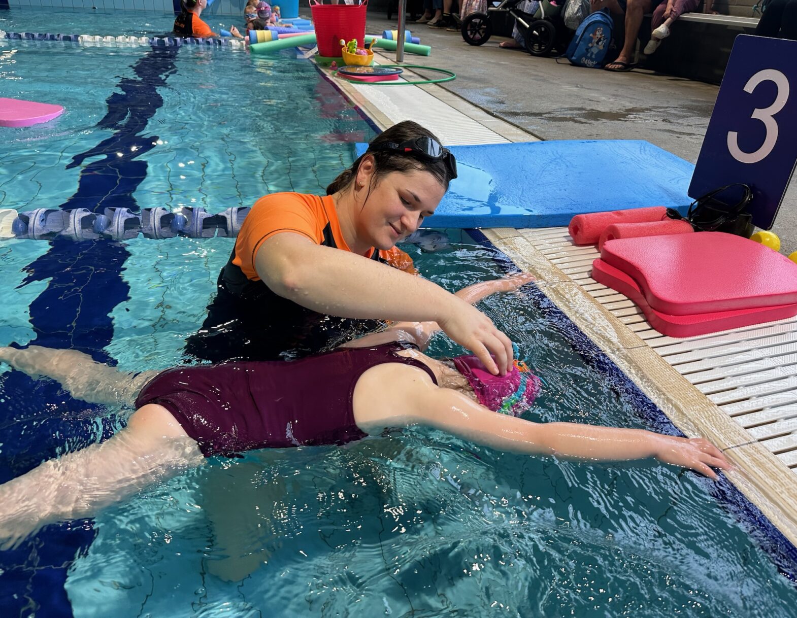 child learning to swim