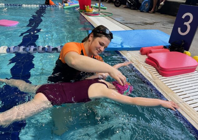 child learning to swim