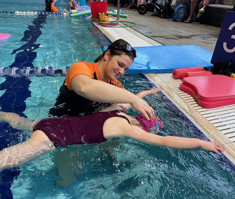 child learning to swim